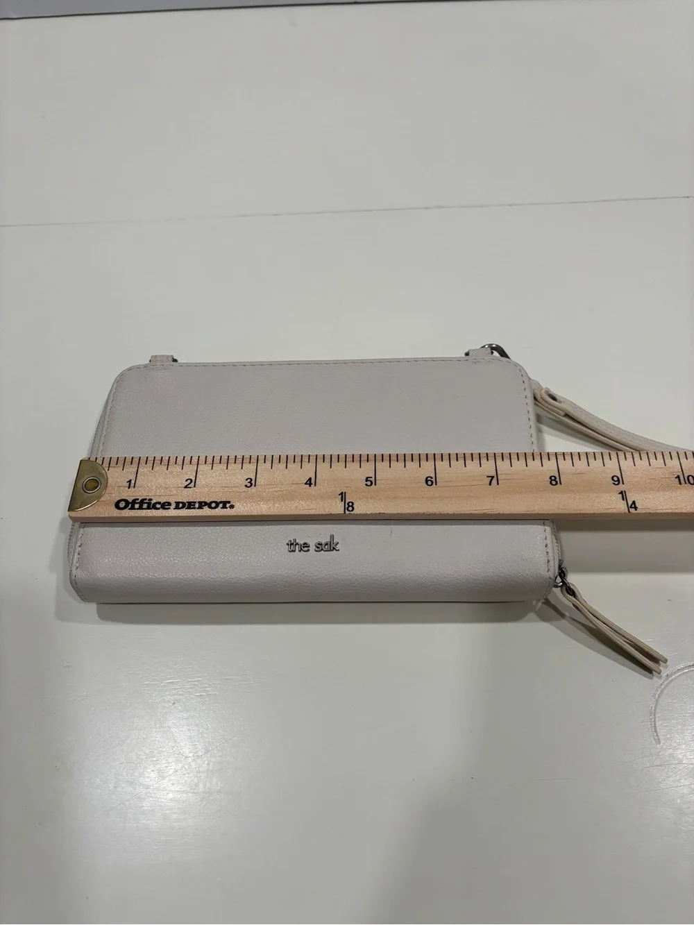 The Sak Light Cream Wristlet Clutch